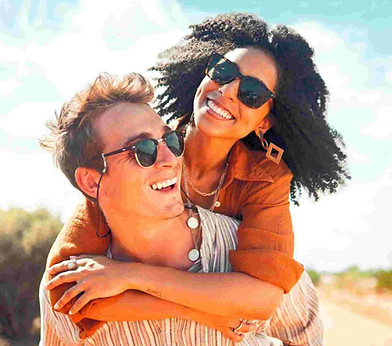 A smiling couple outdoors.