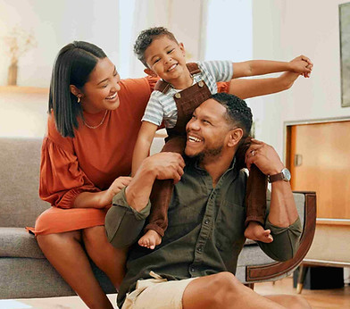A family laughing together at home.
