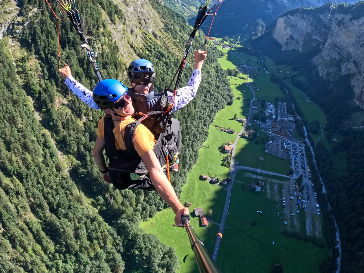 Dr. Peter Robbins paragliding during travel